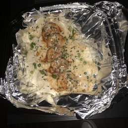 a meal of mashed potatoes, meatballs, and gravy