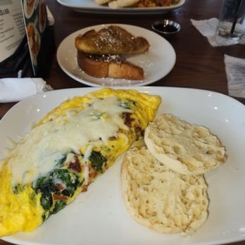 Another Broken Egg Cafe - Sunrise spinach scrambler omlette, English muffins,  beeignet biscuits - Breakfast & Brunch Near Me - Tyler, Texas
