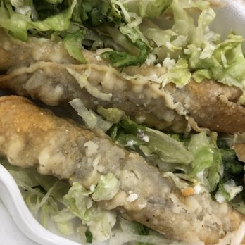 Rico's Tacos El Primo - My uncooked "flautas" that we're really taquitos. GROSS - Tacos Near Me - Riverside, California