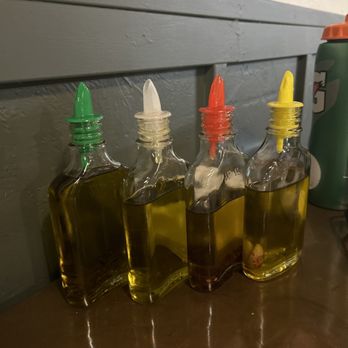 Dodici Pizzeria - Variety of olive oils (rosemary, regular, Carolina reaper, garlic) - Pizza Near Me - Sacramento, California Dodici Pizzeria - Variety of olive oils (rosemary, regular, Carolina reaper, garlic) - Pizza Near Me - Sacramento, California