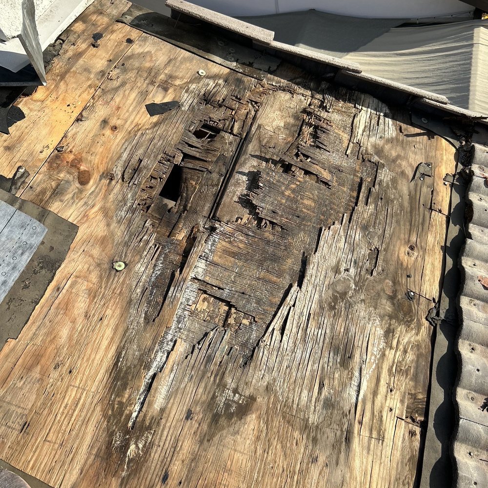 McCormack Roofing - Before: water damaged plywood caused by failing membrane. - Roofing Near Me McCormack Roofing - Before: water damaged plywood caused by failing membrane. - Roofing Near Me