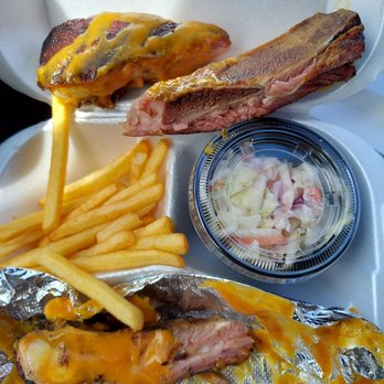 McCray's Backyard BBQ & Seafood - Weirdly cut rib bones with mustard bbq sauce. - Barbeque Near Me - West Palm Beach, Florida McCray's Backyard BBQ & Seafood - Weirdly cut rib bones with mustard bbq sauce. - Barbeque Near Me - West Palm Beach, Florida