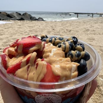 Playa Bowls - a hand holding a bowl of fruit - Juice Bars & Smoothies Near Me - Asbury Park, New Jersey Playa Bowls - a hand holding a bowl of fruit - Juice Bars & Smoothies Near Me - Asbury Park, New Jersey