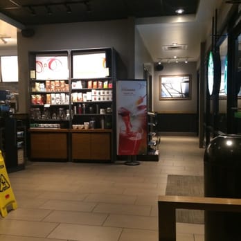 Starbucks - Hallway to restrooms and coffee/tea display shelf. - Coffee & Tea Near Me - Sacramento, California