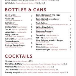 The menu from Beercode Kitchen & Bar includes sections for draft beers, bottles and cans, cocktails, and wines. Draft beers list options like Michelob Ultra, Blue Moon, Modelo, Sierra Nevada Hazy Little Thing, and Sam Adams seasonal beers with prices. Bottles and cans include Coors Light, Miller Lite, Budweiser, Stella Artois, Dos XX, and others, with prices ranging from $7 to $9. Cocktails feature drinks like Mimosa, Tito's Bloody Mary, American Mule, Old Fashioned, and Runway Margarita, priced at $15. Wines are available in 5oz servings, including options like Benvolio, Brut Champagne, Tommasi, Daschwood, Columbia, and Dough, with prices from $13 to $18.