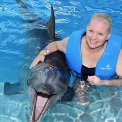 Paley Orthopedic & Spine Institute - Brenda and dolphin in Cancun