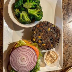 Depot Bar And Grill - Black bean veggie burger with a side of steamed broccoli.