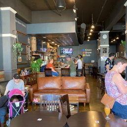 people sitting at tables and eating