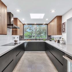 KabCo Kitchens - Walnut and black finishes give this kitchen an effortlessly stylish and sophisticated edge.