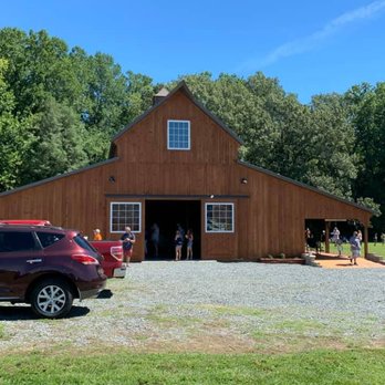 Backporch Vineyard - a car parked in front of a barn - Wineries Near Me - King George, Virginia