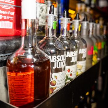 Bachelor Forum - bottles of alcohol lined up on a shelf - Gay Bars Near Me - Rochester, New York
