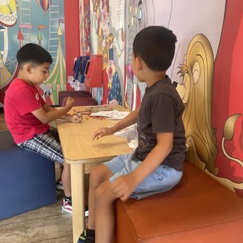 Children's Happy Teeth - Lakewood - Waiting area, kids coloring so they don't get bored while waiting and watching a movie - Pediatric Dentists Near Me - Lakewood, California