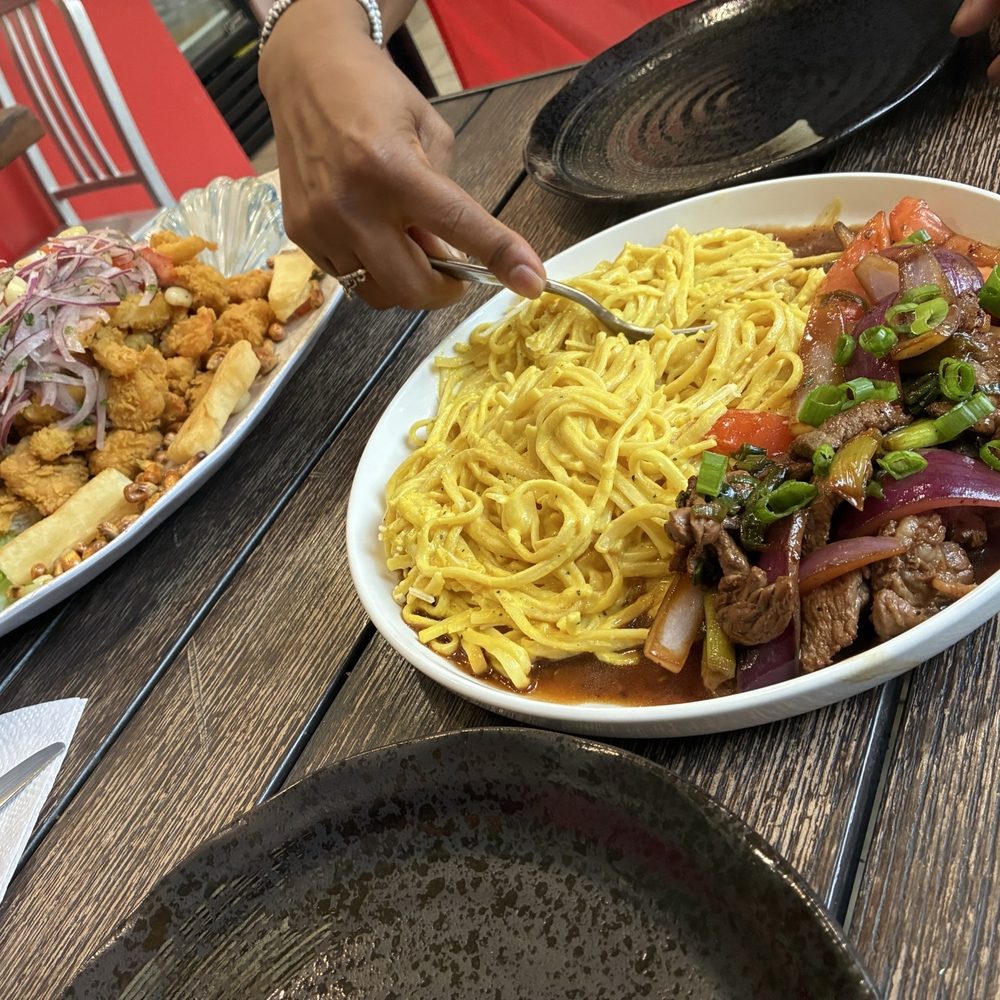 Jalea Familia and Lomo Saltado con pasta huancaina Jalea Familia and Lomo Saltado con pasta huancaina