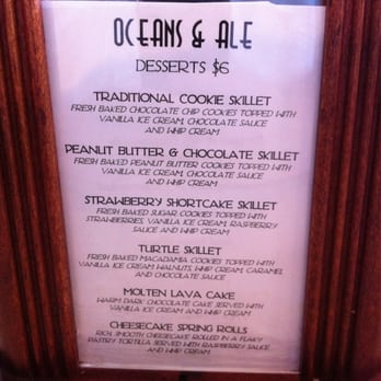 Oceans & Ale - Warm cookie in an iron skillet topped with ice cream. - Seafood Near Me - Williamsburg, Virginia Oceans & Ale - Warm cookie in an iron skillet topped with ice cream. - Seafood Near Me - Williamsburg, Virginia