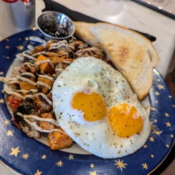 Toad in the Hole - Sweet potato, potato, red onion, cremini mushroom hash with house made sausage, and a blueberry ginger pear jam - Breakfast & Brunch Near Me - Eagle River, Wisconsin