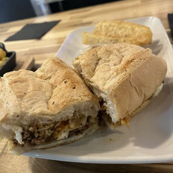 Zeke's Kitchen & Bar - Haitian sandwich- the yuca fries were really good! - New American Near Me - Smyrna, Georgia Zeke's Kitchen & Bar - Haitian sandwich- the yuca fries were really good! - New American Near Me - Smyrna, Georgia