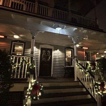 La Nouvelle - Outside restaurant with seating on the wrap around porch. - French Near Me - Saint Augustine, Florida