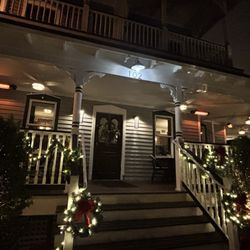 La Nouvelle - Outside restaurant with seating on the wrap around porch.