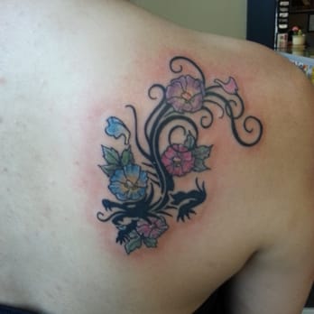 Red Rocket Tattoo - by Erica. Tribal dragon with hibiscus flowers. 1.5 hours - Tattoo Near Me - New York, New York Red Rocket Tattoo - by Erica. Tribal dragon with hibiscus flowers. 1.5 hours - Tattoo Near Me - New York, New York
