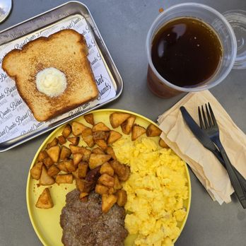 Burnt Crumbs - 2 eggs with breakfast potatoes, sausage, and Texas toast. - New American Near Me - Irvine, California