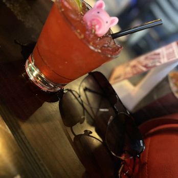 Twisted Pig Bar and Grill - a drink with a pink pig on it - American Near Me - Modesto, California Twisted Pig Bar and Grill - a drink with a pink pig on it - American Near Me - Modesto, California