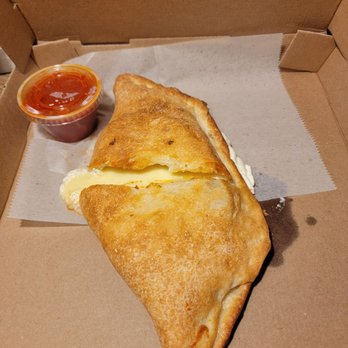 Drago’s Pizza - Ricotta & mozzarella calzone-- crispy chewy crust! Yum! - Pizza Near Me - Farmingville, New York Drago’s Pizza - Ricotta & mozzarella calzone-- crispy chewy crust! Yum! - Pizza Near Me - Farmingville, New York