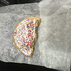 The uneaten half of there Dot Cookie.