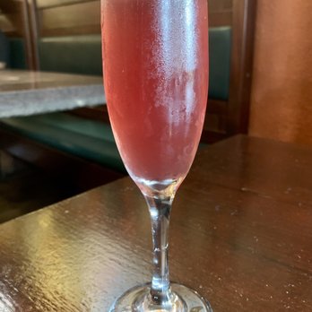 White Wolf Cafe - Pomegranate mimosa - New American Near Me - Orlando, Florida White Wolf Cafe - Pomegranate mimosa - New American Near Me - Orlando, Florida