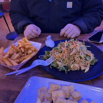 Fusion Fare Restaurant - Top right: spicy red oil style fries Middle: Szechuan numbing noodles Bottom: salted egg yolk tofu Red - Szechuan Near Me - Santa Cruz, California