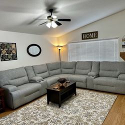 Action Home Furnishings - Very comfortable sectional, 3 seats are electric recliners with moveable headrests.