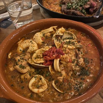 Bulla Gastrobar - Front: Arroz Caldoso Back: Ribeye Paella - Spanish Near Me - Plano, Texas Bulla Gastrobar - Front: Arroz Caldoso Back: Ribeye Paella - Spanish Near Me - Plano, Texas