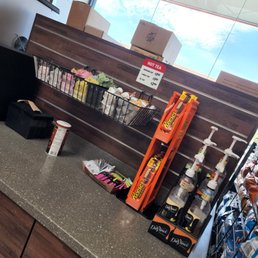 Variety of creamers and syrups. There are more at nearby tables also. Variety of creamers and syrups. There are more at nearby tables also.