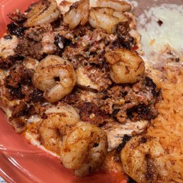 Chorizo with chicken and I asked for shrimp to be added, comes with refried beans and rice. Soooooo goood!!! Highly suggest! Chorizo with chicken and I asked for shrimp to be added, comes with refried beans and rice. Soooooo goood!!! Highly suggest!