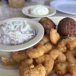 Light fried shrimp platter with coleslaw and potato salad. Light fried shrimp platter with coleslaw and potato salad.