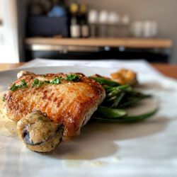 iconiq - NEAH BAY PETRALE SOLE MEUNIÈRE with herbed-garlic escargot beignet, haricot vert and fingerling potatoes