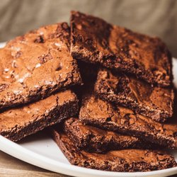 Rise & Shine Coffee and Burritos - Delcious, chunky fudge brownie made with simple ingredients! Try out our huge selection of made from scratch pastries and baked goods!