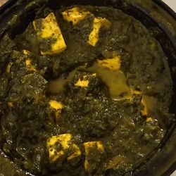 Aman's Indian Bistro - Watery, oily and unspiced "hot" saag paneer.
