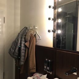 Hangers next to the front door on one side, next to the sink on the other side