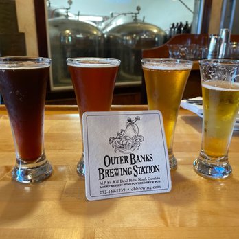 Outer Banks Brewing Station - Trying a flight. Near Kitty Hawk NC - Seafood Near Me - Kill Devil Hills, North Carolina Outer Banks Brewing Station - Trying a flight. Near Kitty Hawk NC - Seafood Near Me - Kill Devil Hills, North Carolina