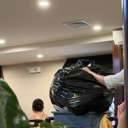 Taking trash out while eating?!