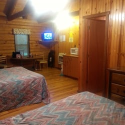 Cookson Log Cabin Motel - Inside cabin 2 (two queen sized beds, TV w/basic channels, full bathroom, kitchen w/stove top, mini-fridge, microwave & sink)