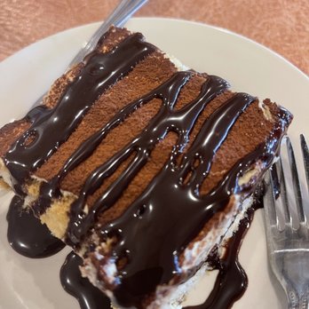 Albasha's Restaurant - a piece of cake on a plate with a fork - Greek Near Me - Prairieville, Louisiana