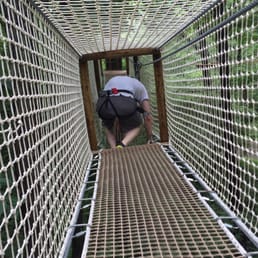One of the obstacles is to crawl through this, while suspended in air.