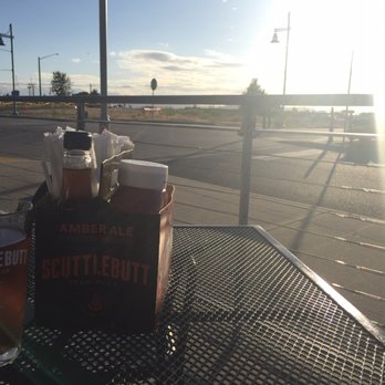 Scuttlebutt Brewing Company - Sitting outside overlooking the pier - American Near Me - Everett, Washington Scuttlebutt Brewing Company - Sitting outside overlooking the pier - American Near Me - Everett, Washington