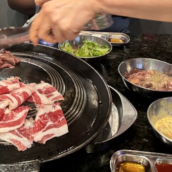 Honey Pig BBQ - The lady came to help us cook - Korean Near Me - Houston, Texas Honey Pig BBQ - The lady came to help us cook - Korean Near Me - Houston, Texas