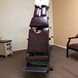 Advanced Chiropractic Clinic and Acupuncture - Chiropractic treatment room with pneumatic, air compressed treatment table.