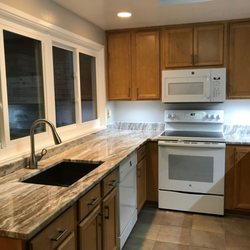 Brown fantasy granite kitchen countertop. Call today (240) 330-9008