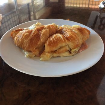 Le Cafe De Paris - A ham and Brie breakfast sandwich on croissant bread. - Coffee & Tea Near Me - Orlando, Florida Le Cafe De Paris - A ham and Brie breakfast sandwich on croissant bread. - Coffee & Tea Near Me - Orlando, Florida