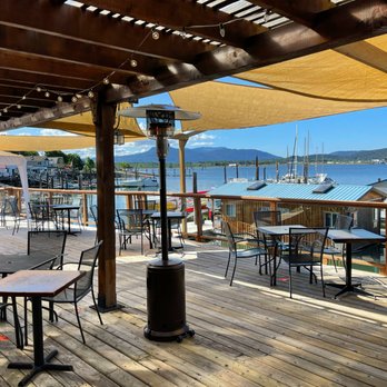 The Vine - tables and chairs on a deck overlooking the water - Creperies Near Me - Duncan, British Columbia
