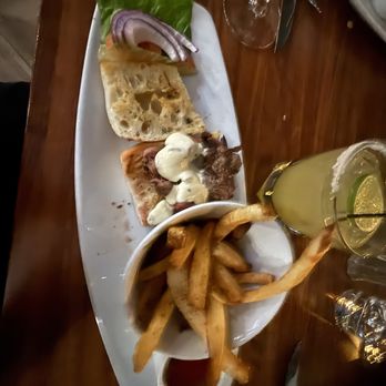 Ruth's Chris Steak House - Half of the steak sandwich.  Meat was so tender. We were sharing so they plated two plates. - Steakhouses Near Me - Albany, New York